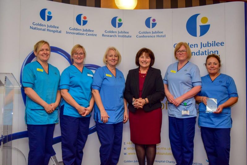 Cabinet Secretary for Health and Sport, Jeane Freeman MSP, presenting award