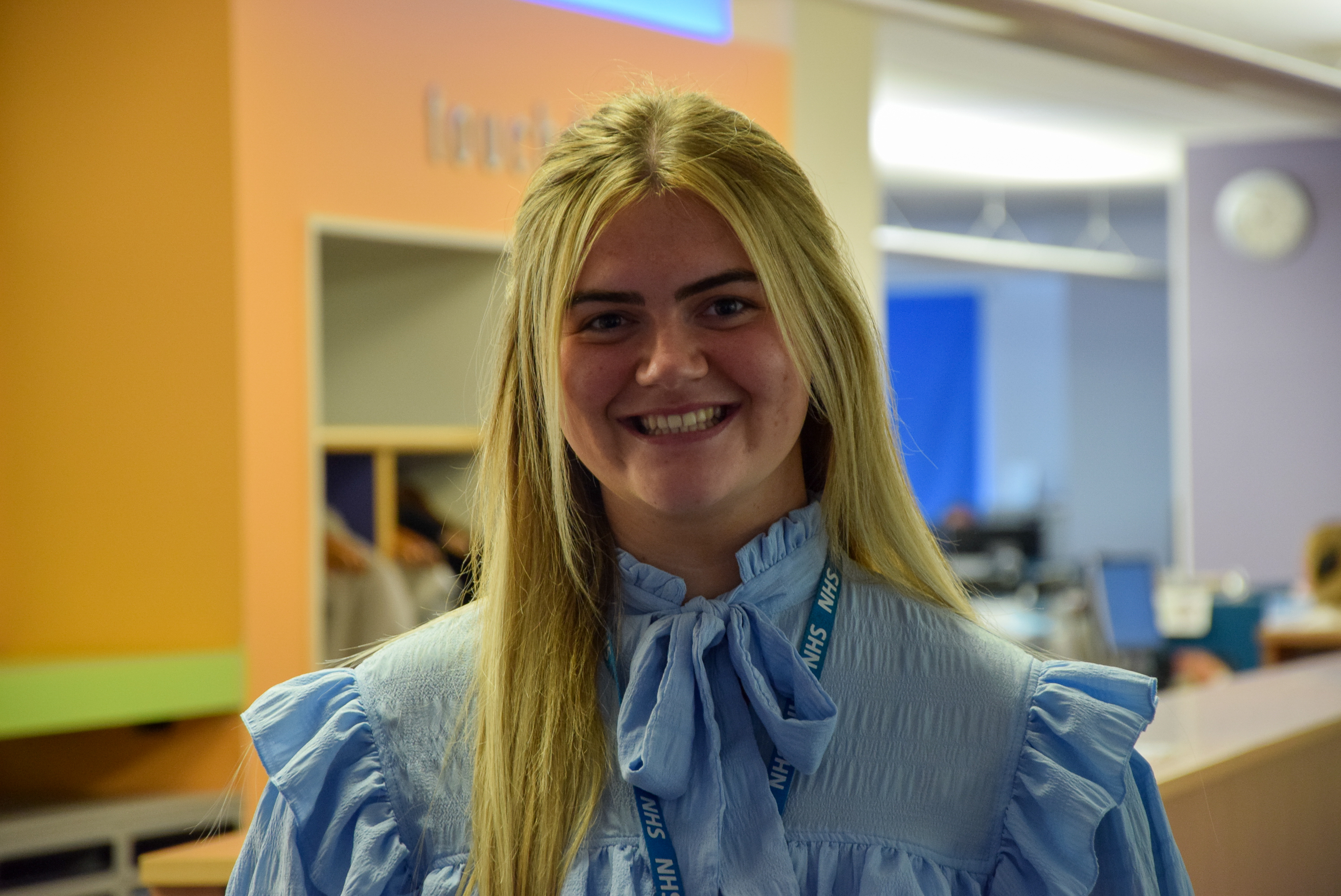 Ciara Gallacher smiling in front of office.