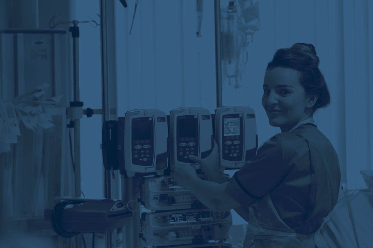 nurse monitoring patient with machines