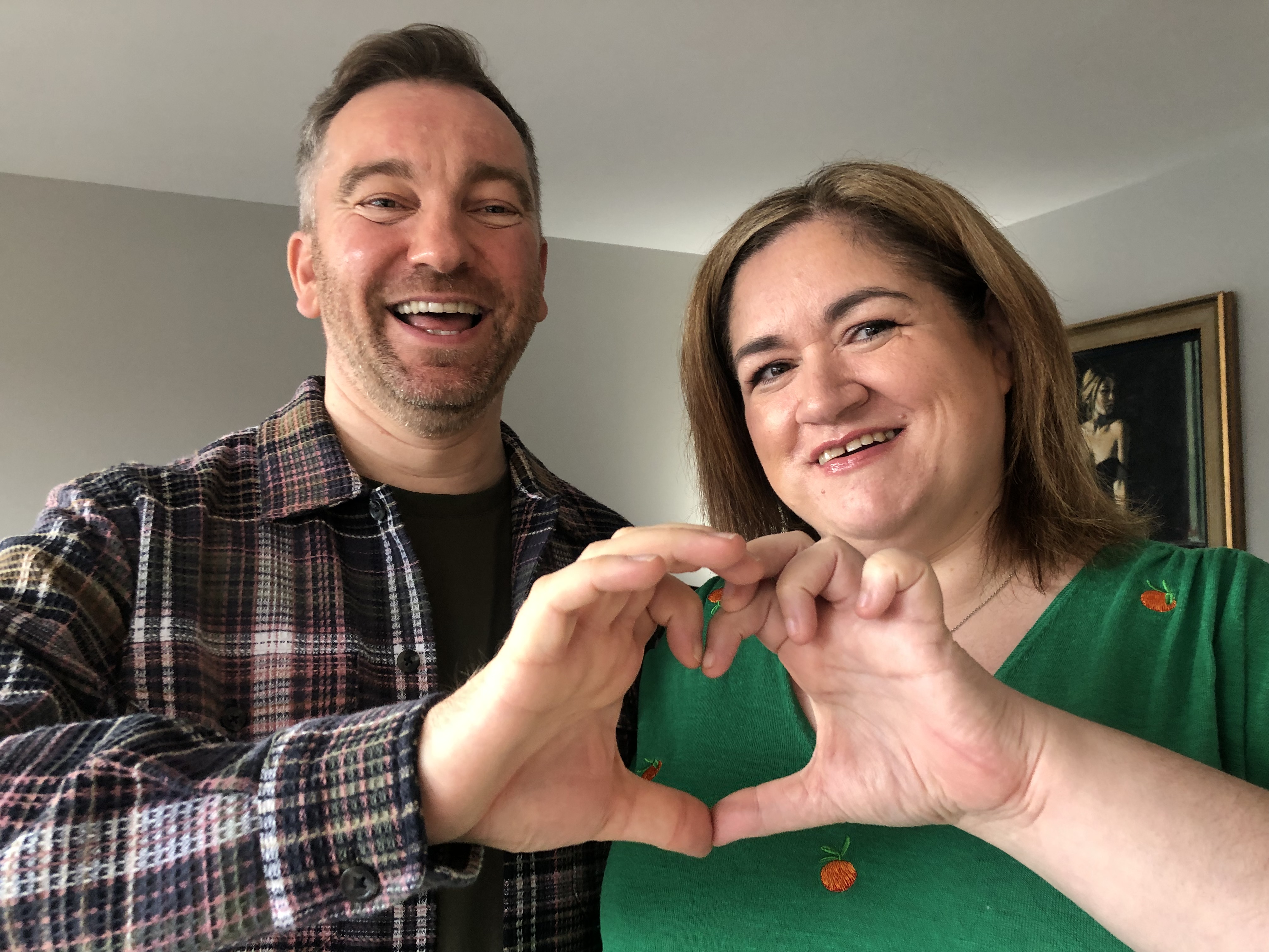 Fraser Wilson and Louise Campbell, heart transplant patients, creating love heart together with hands.
