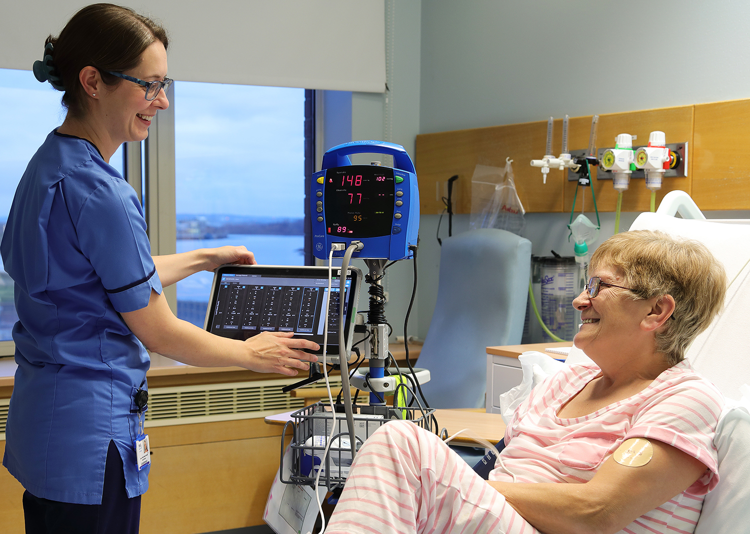 Golden Jubilee Nurse with patient.jpg