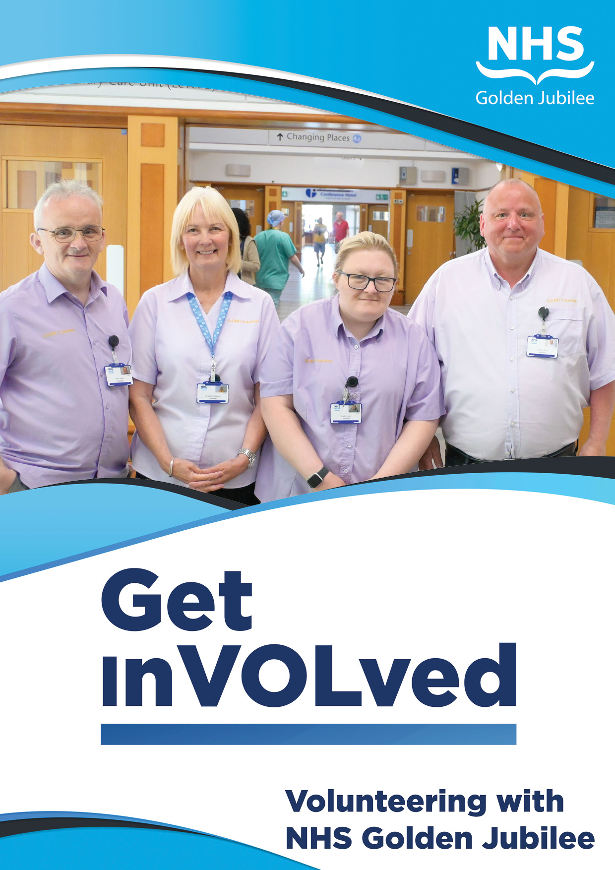 Female hospital volunteer sitting at desk with pen in hand.