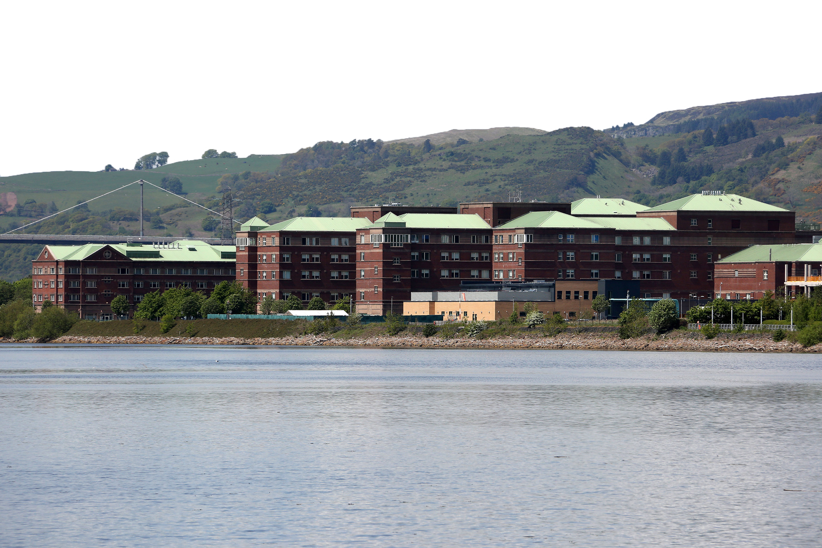 Long shot of NHS Golden Jubilee University National Hospital with transparent sky in background.